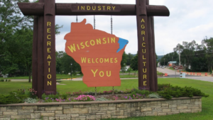 Picture of sign shaped like Wisconsin stating that "Wisconsin Welcomes You"