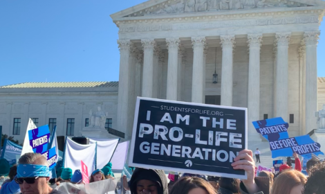 Sign stating "I am the pro-life generation" in front of the Supreme Court of the United States