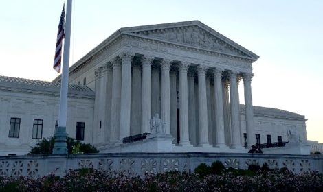 Photo of Supreme Court with half mast American flag