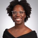 Headshot of Kaleea R. Lewis, MSPH, PhD. Black woman with clear glasses and short hair, wearing black off the shoulder shirt