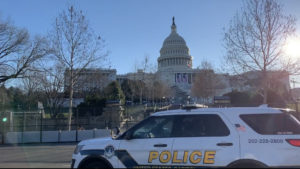 Capitol building fenced with police car