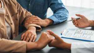 Infertile and medical consultation between young couple and doctor. Neoteric stock photo ; Reproaction